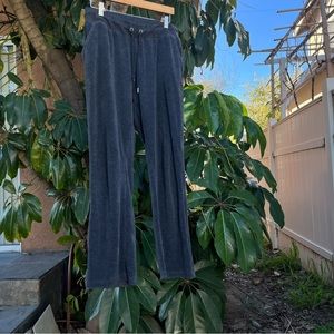 Bebe velour grey pants with a rhinestone detailing on the back that reads “Bebe”